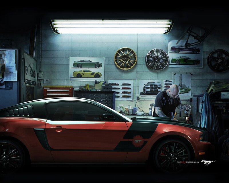 Mechanic working on a red Mustang