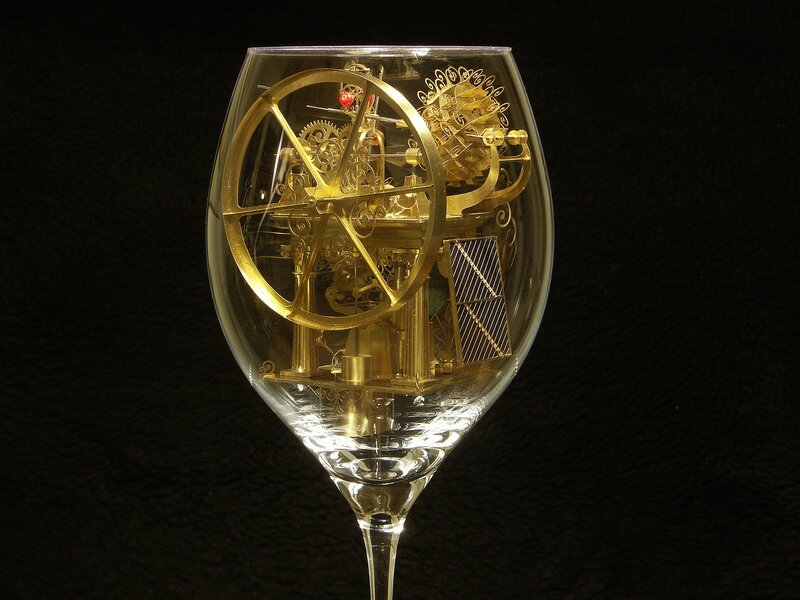 Mechanical clock in a wine glass