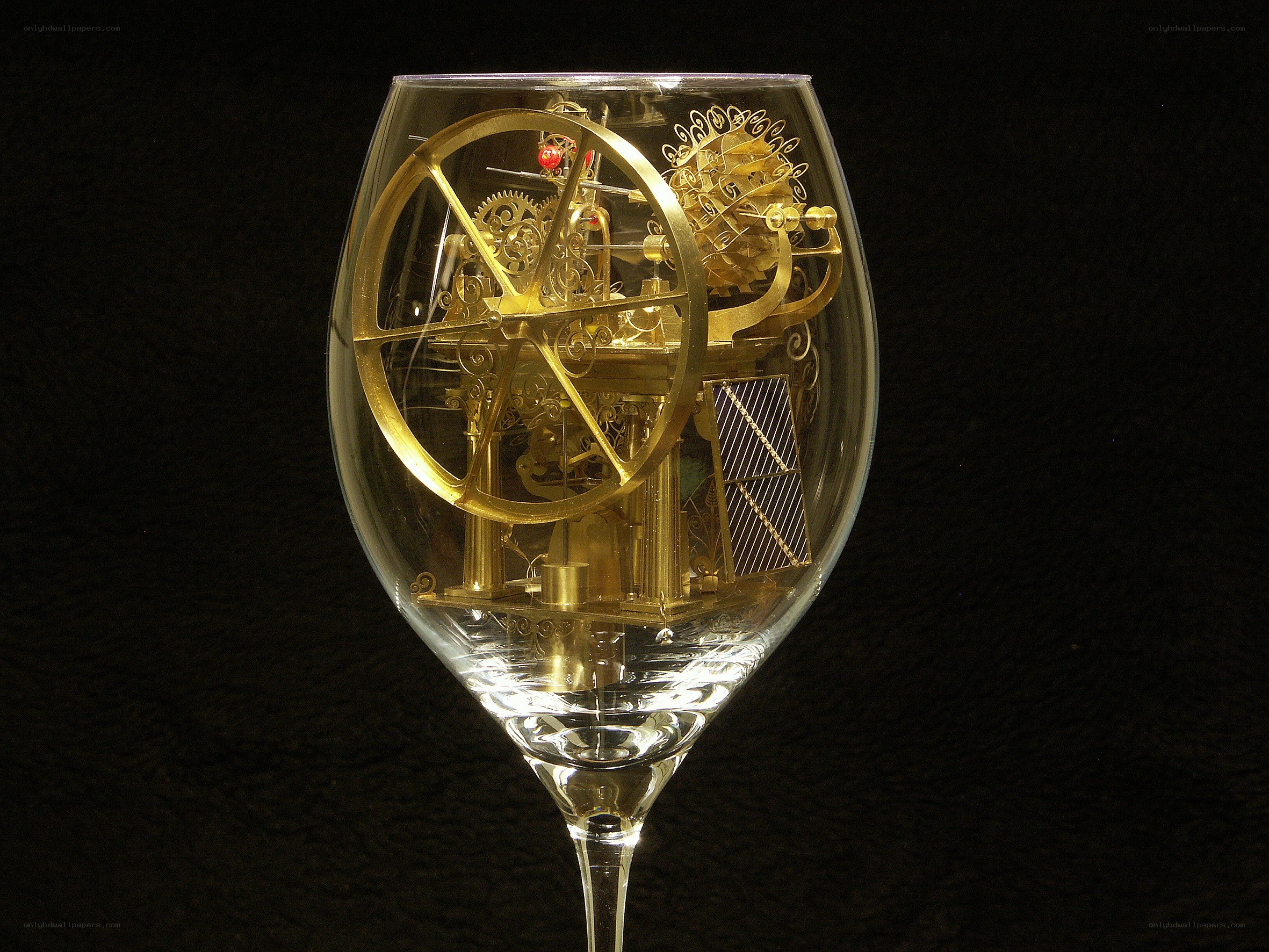 Mechanical clock in a wine glass