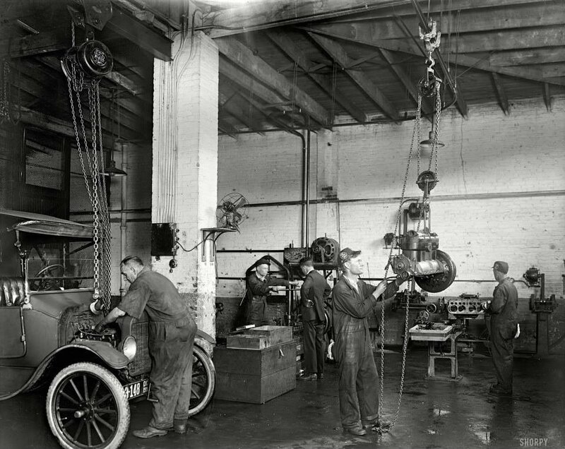 Mechanics working in a garage