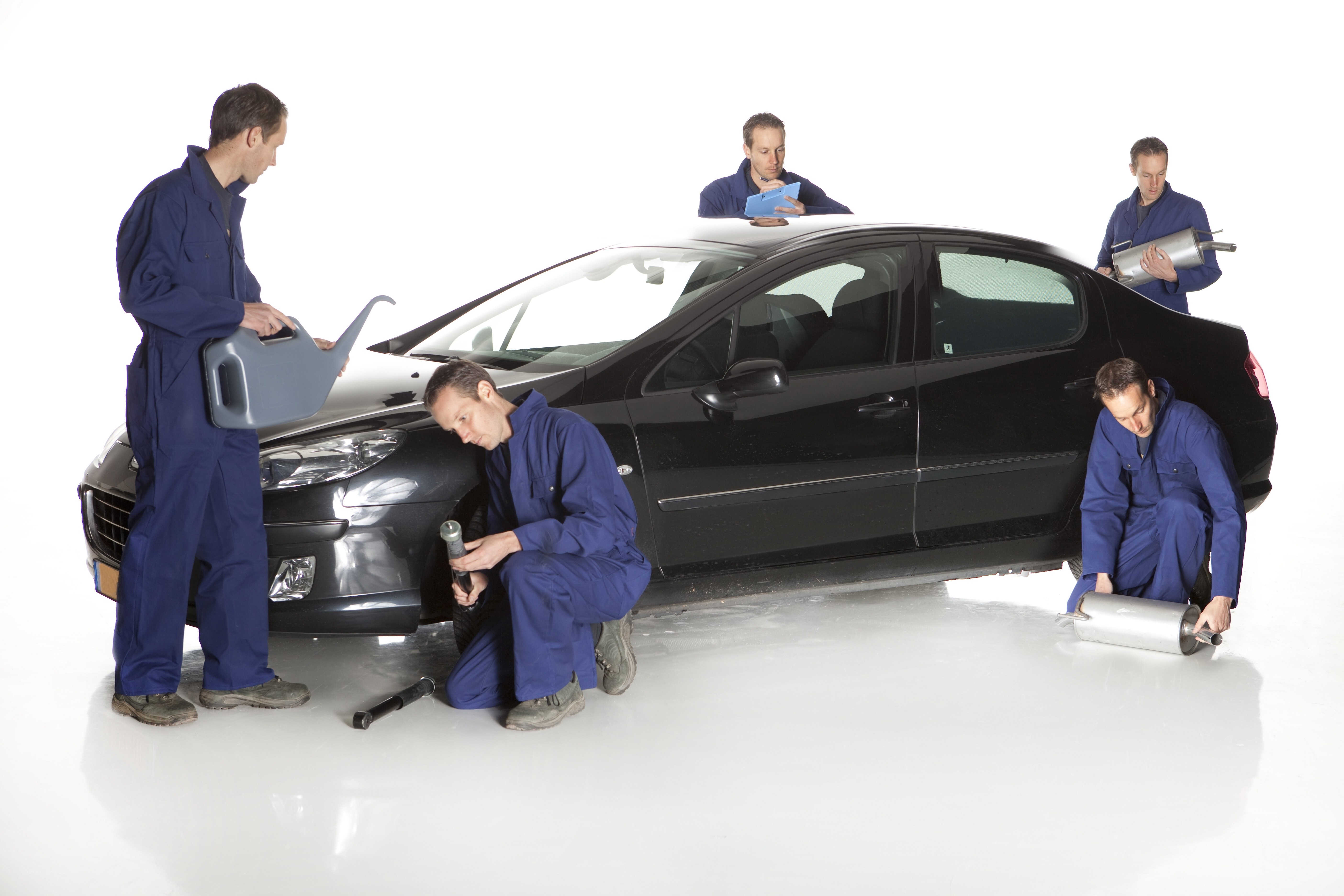 Mechanics working on a car