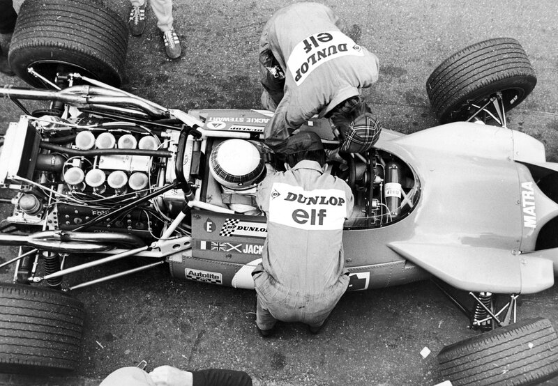 Mechanics working on a race car