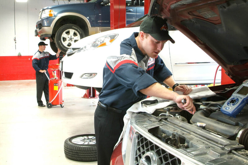 Mechanics Working on Cars — Blue