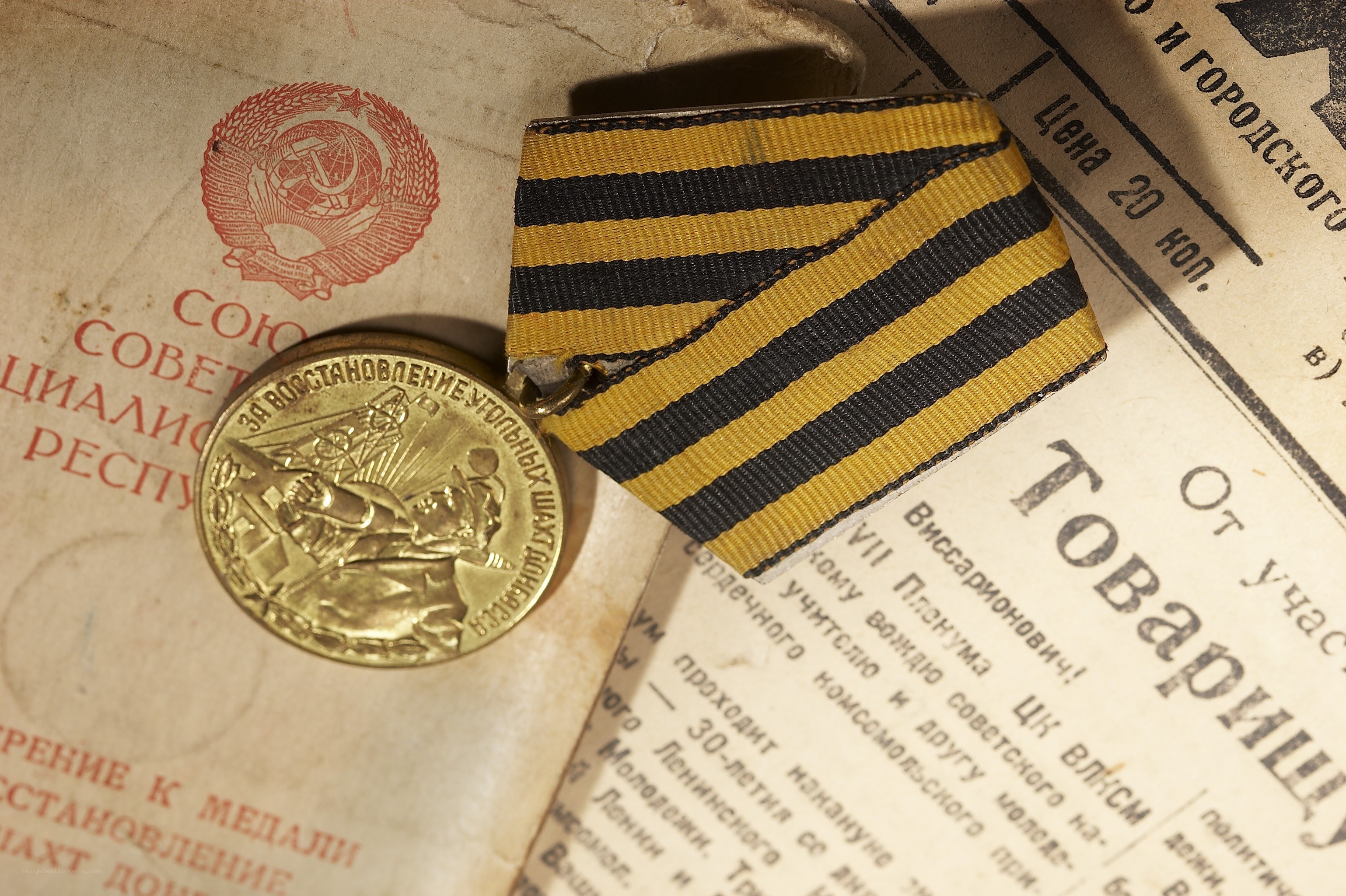 Medal on newspaper document