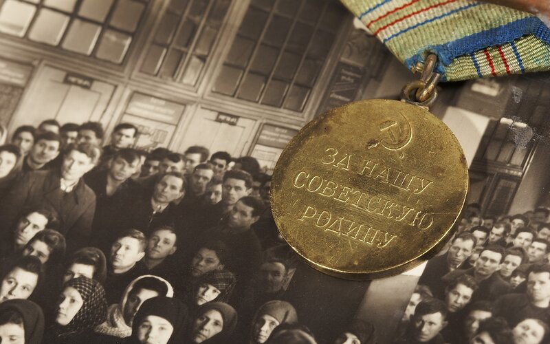 Medal over photo of crowd