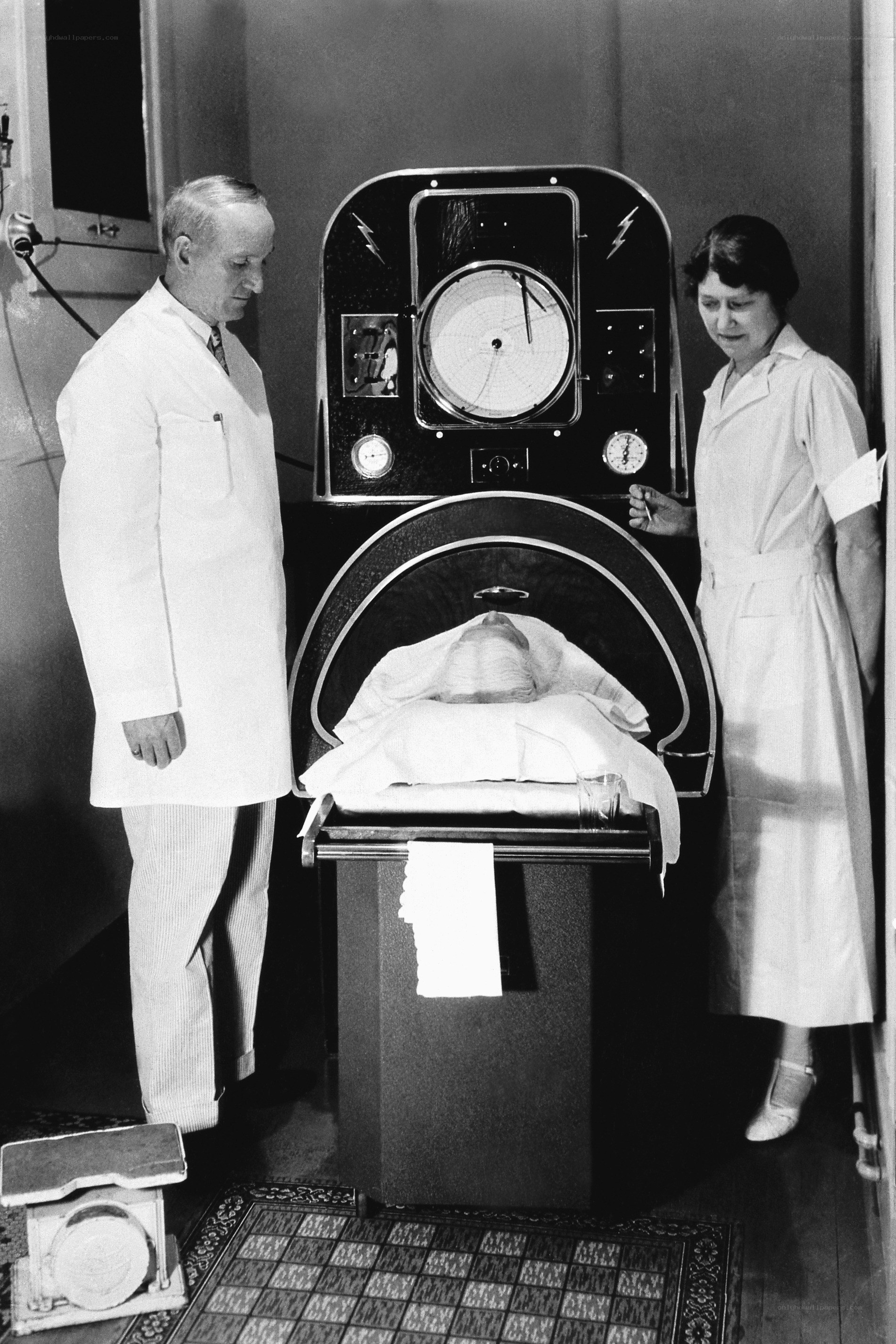 Medical staff with early X-ray machine