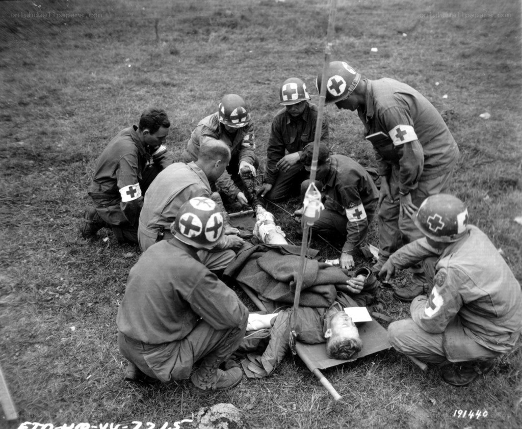Medics treating wounded soldier