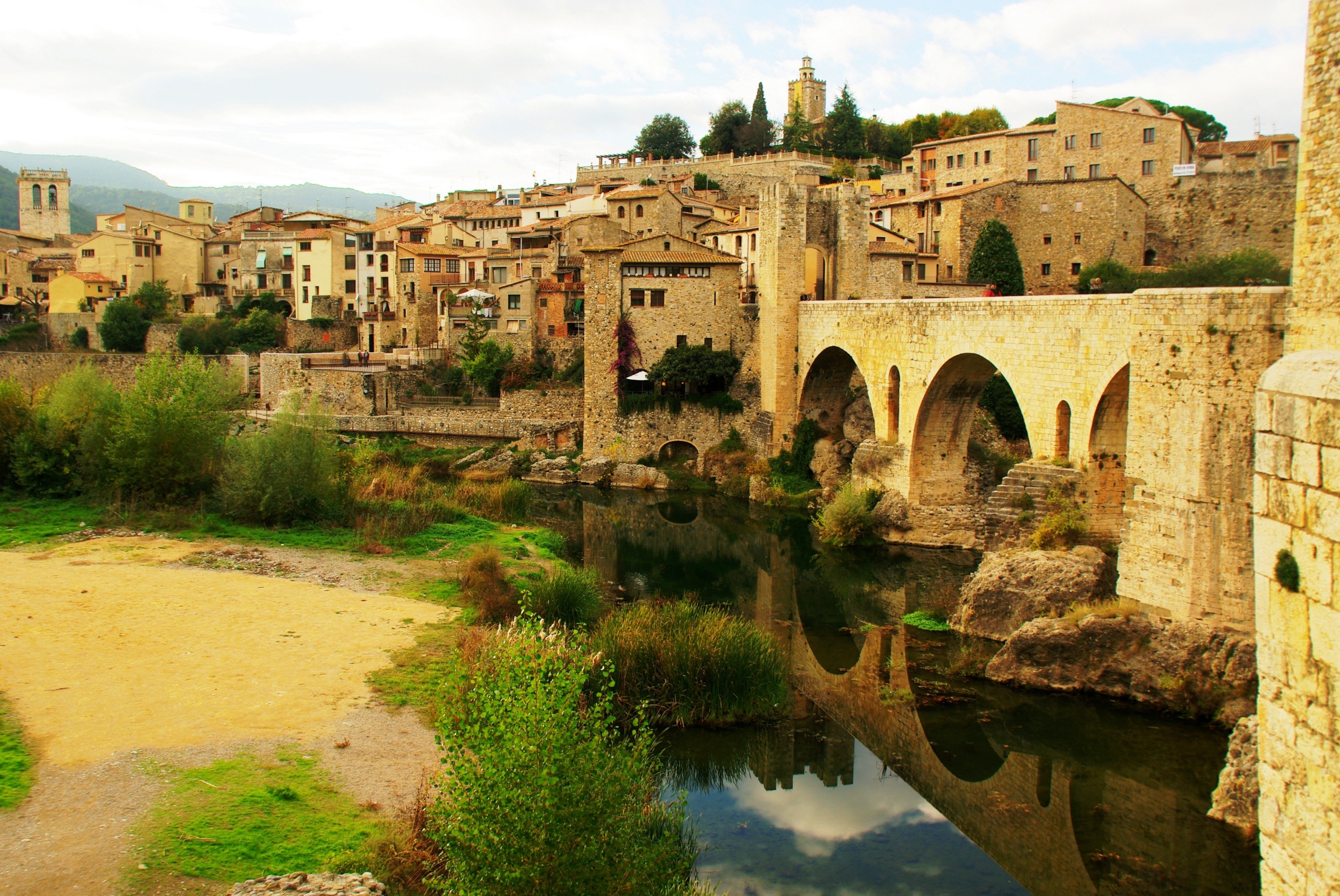 Medieval bridge over river in town