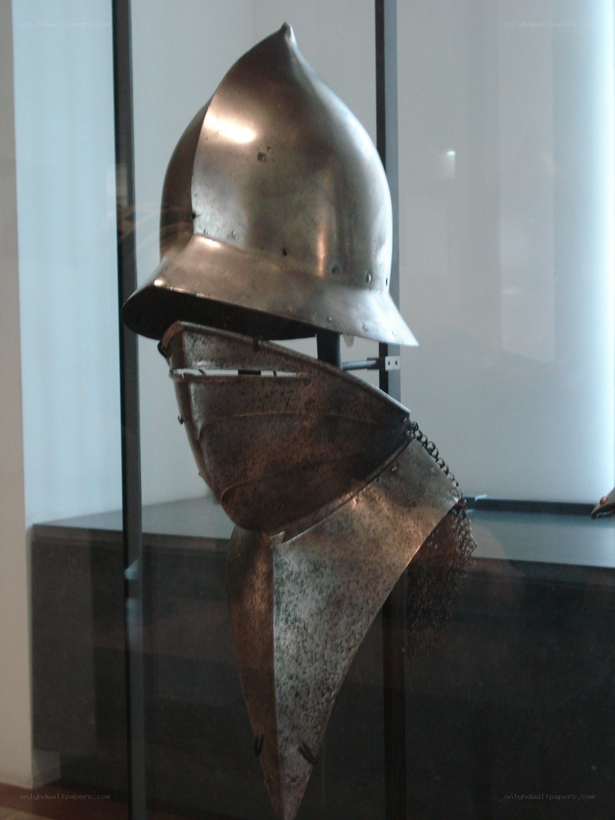 Medieval helmet in display case