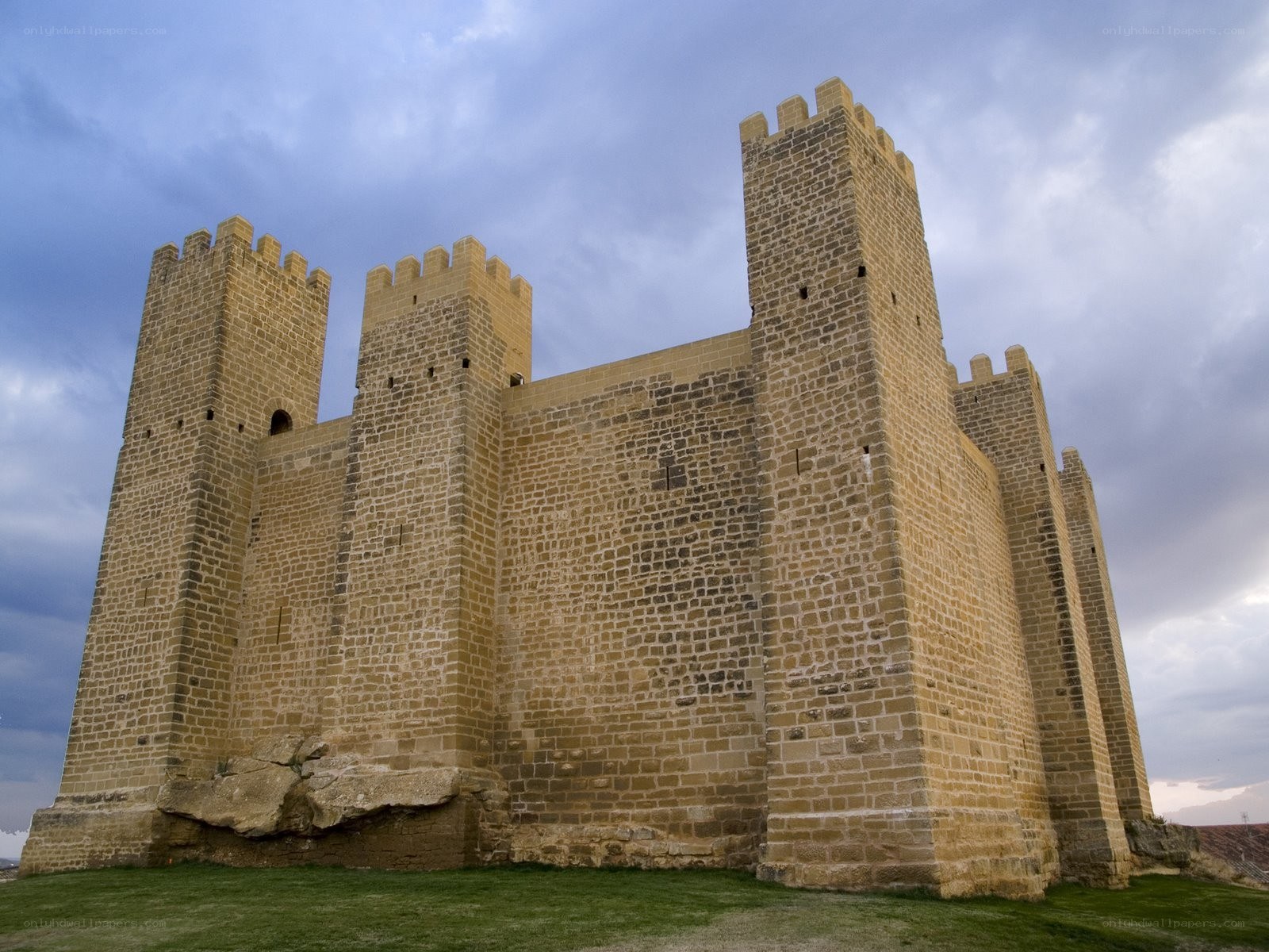 Medieval stone castle under cloudy sky