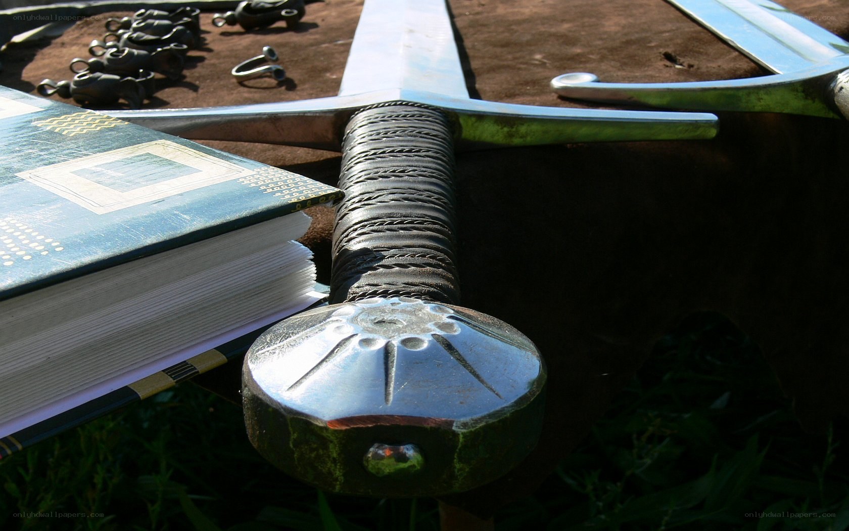 Medieval sword and book