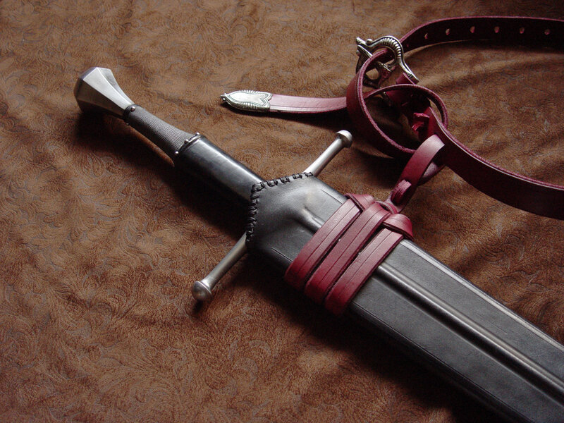 Medieval sword in leather sheath