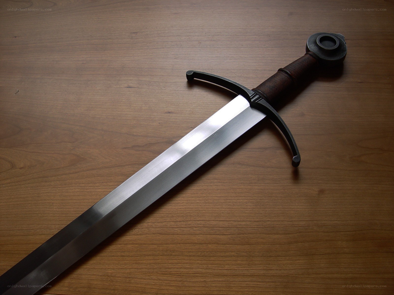 Medieval sword on wood