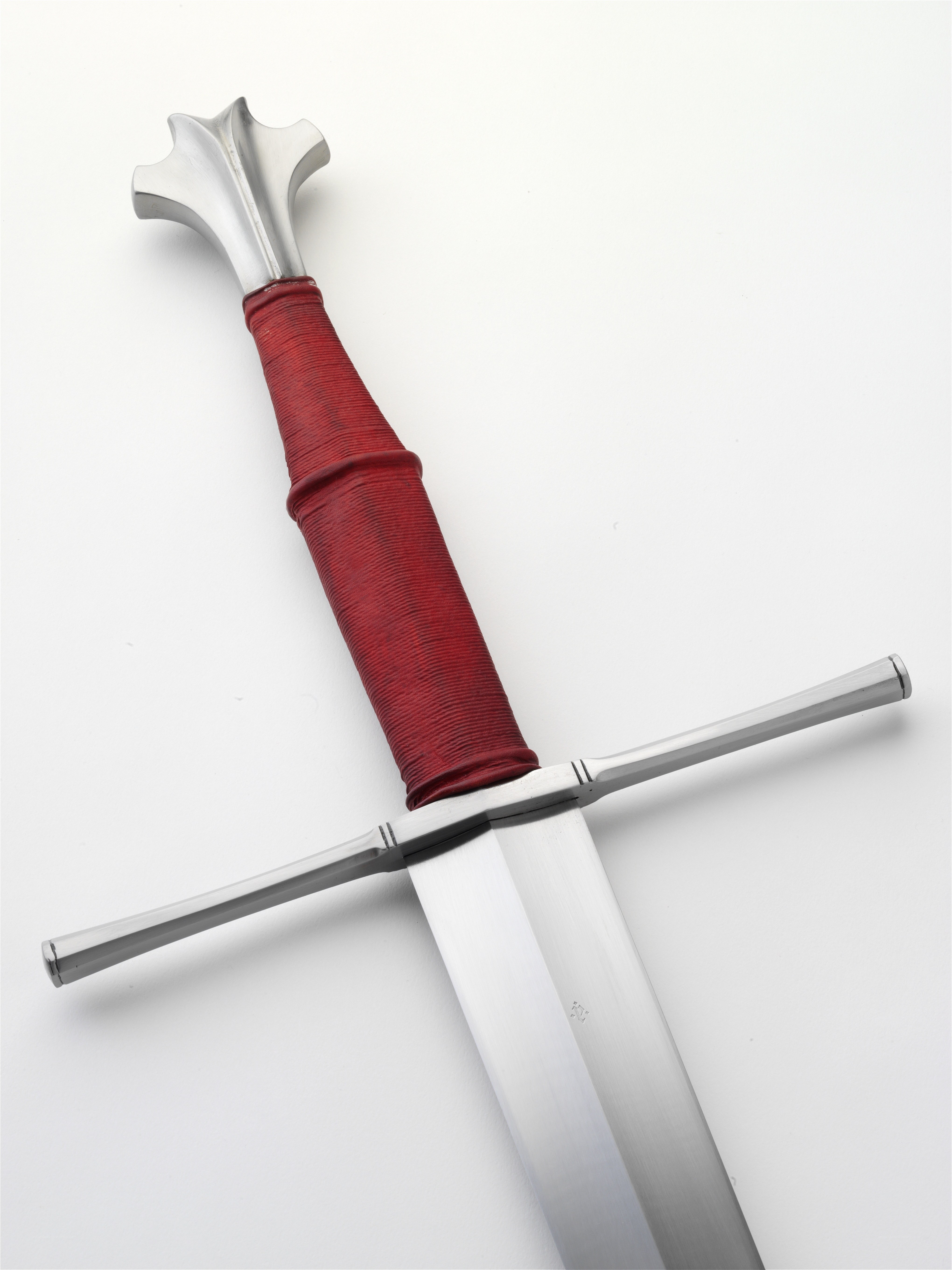 medieval sword with red grip