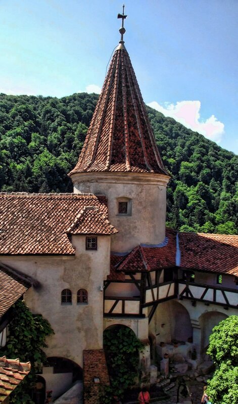medieval tower in a forested valley