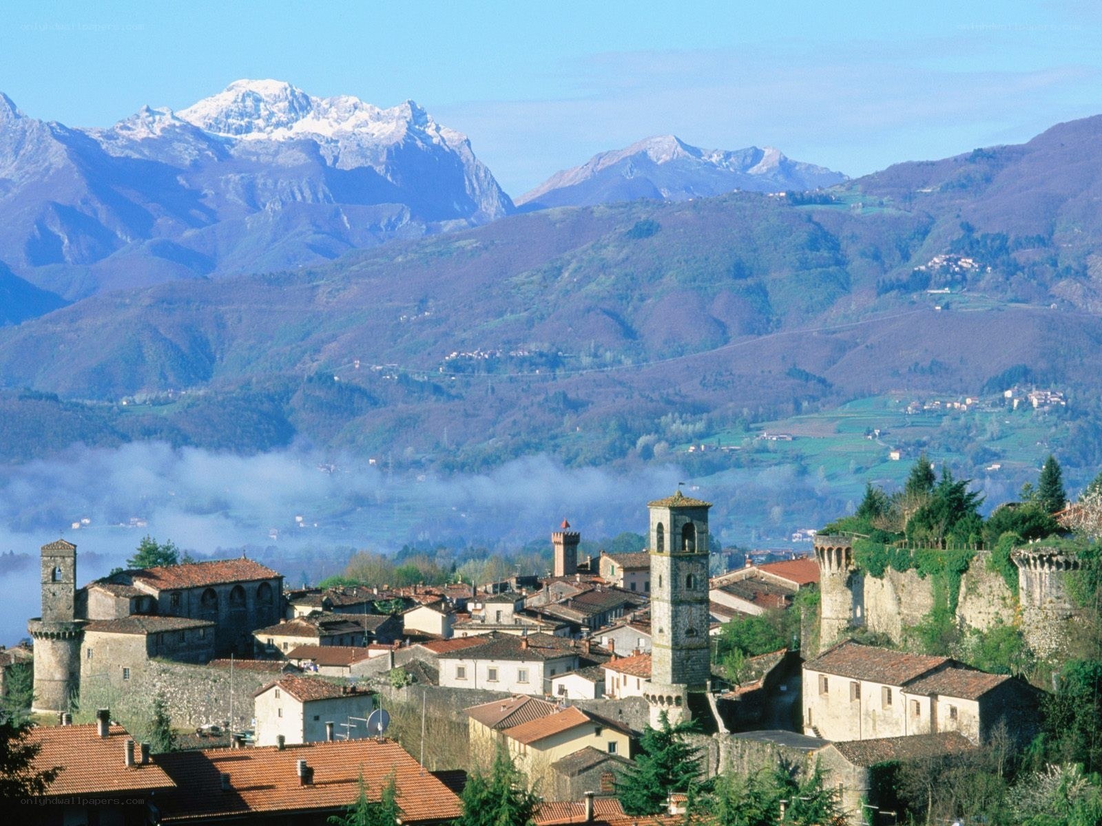medieval town with mountain backdrop