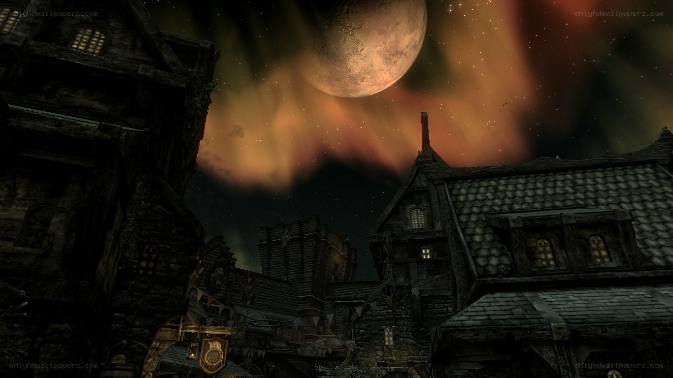 medieval village under a large moon