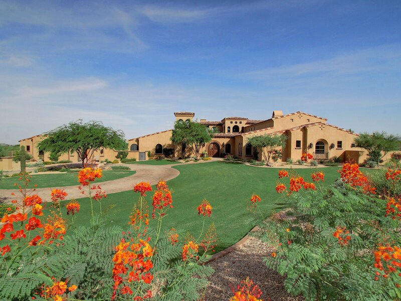 Mediterranean-style home with vibrant garden