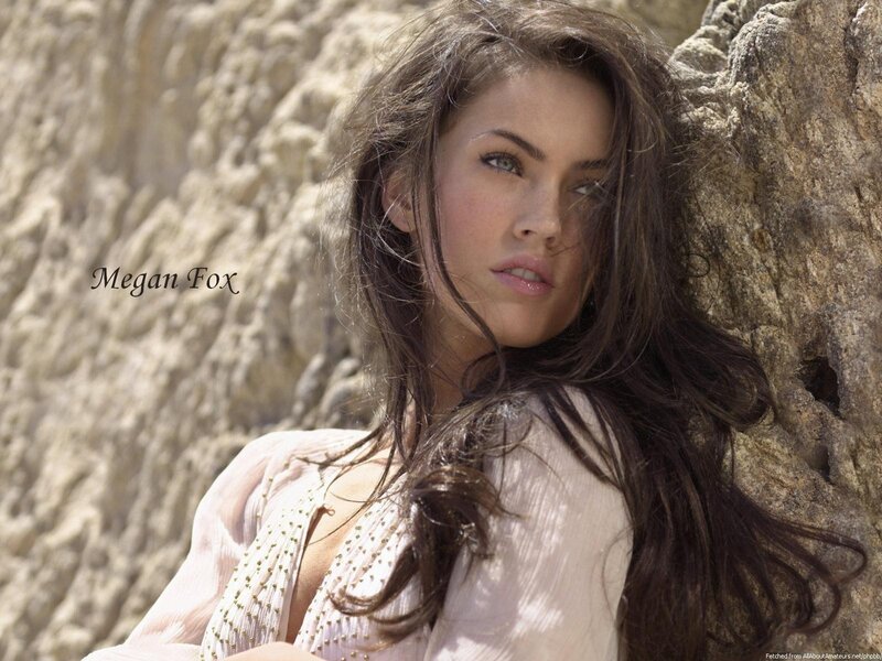 Megan Fox by rock wall