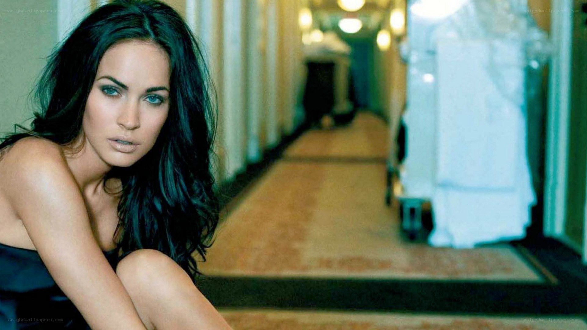 Megan Fox in a hallway
