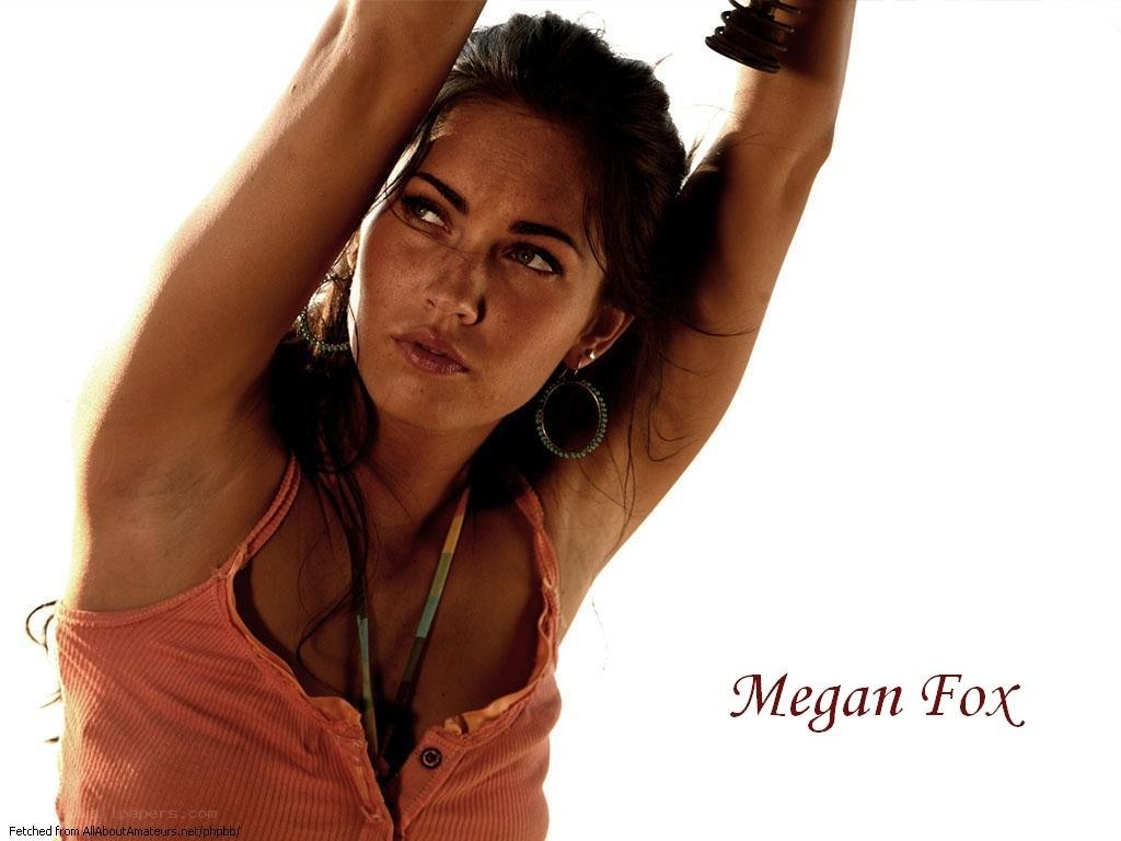 Megan Fox posing with arms raised