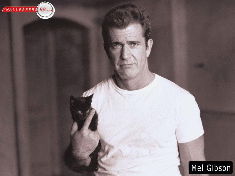 Mel Gibson holding a kitten
