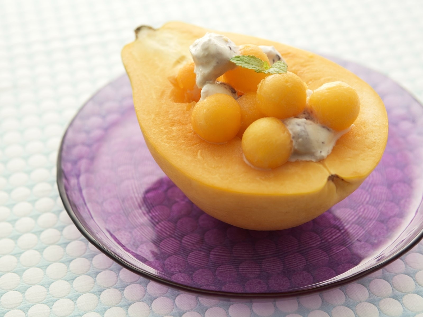 Melon dessert in papaya bowl
