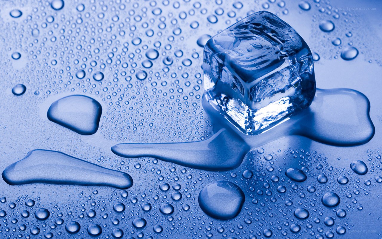 melting ice cube on wet surface