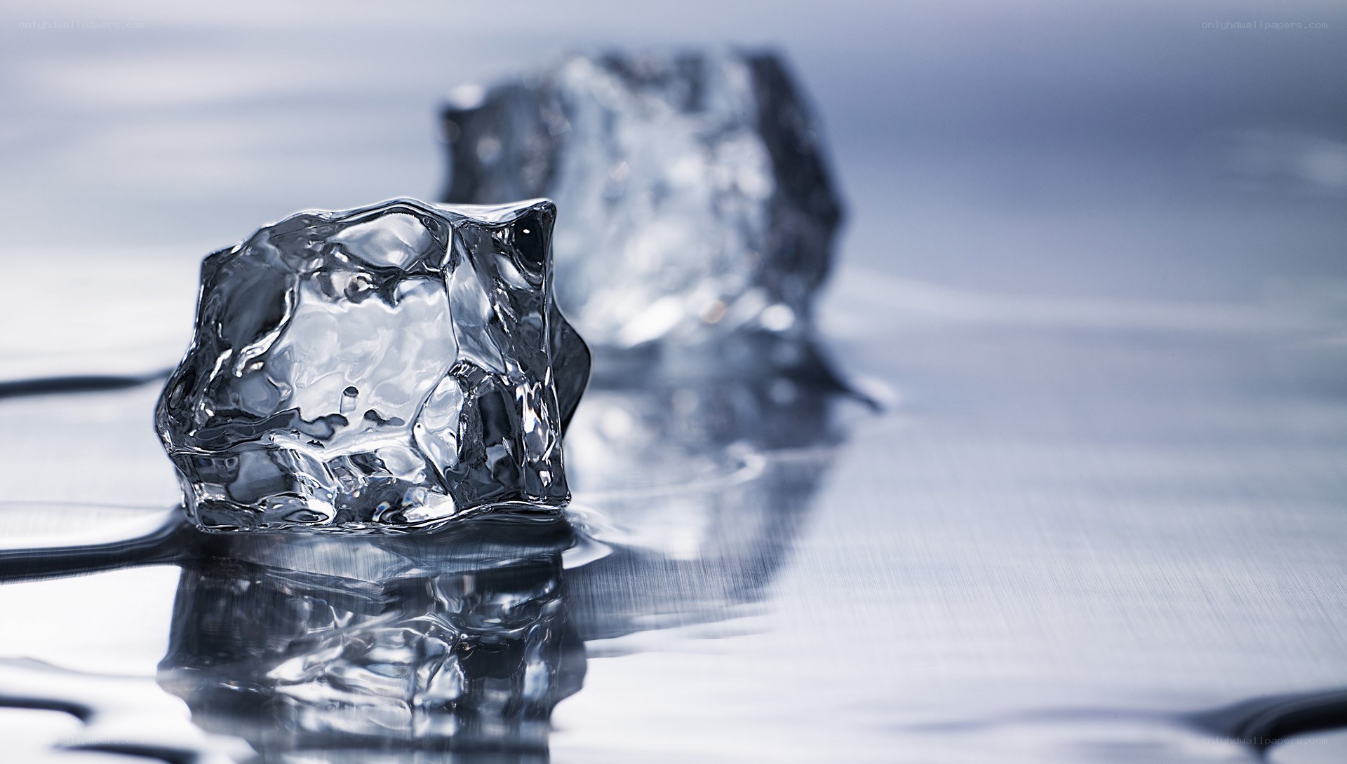 melting ice cubes on metal