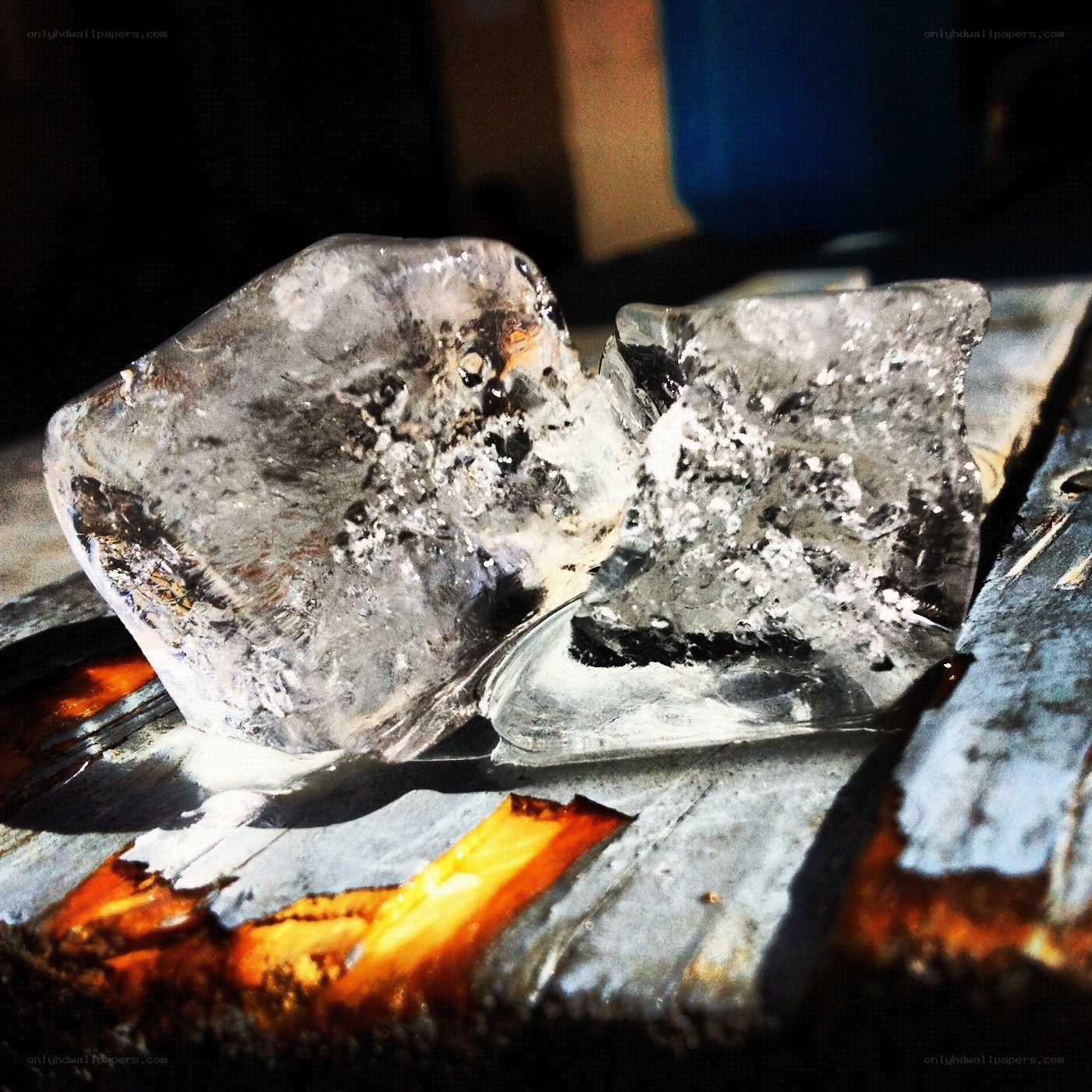 melting ice on a wooden surface