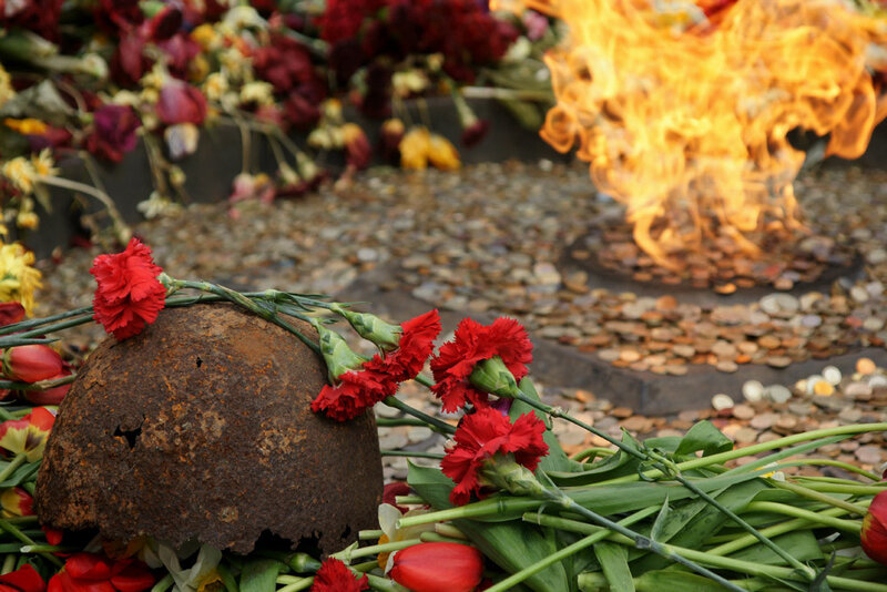 Memorial with flowers and flame