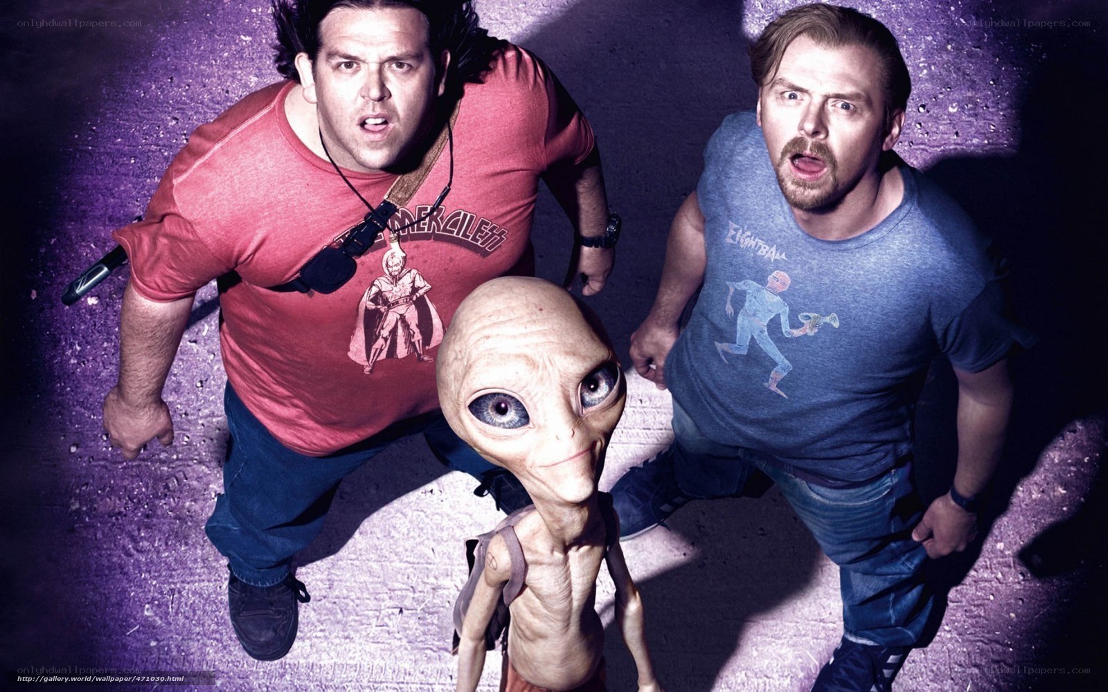 Men and alien in purple light