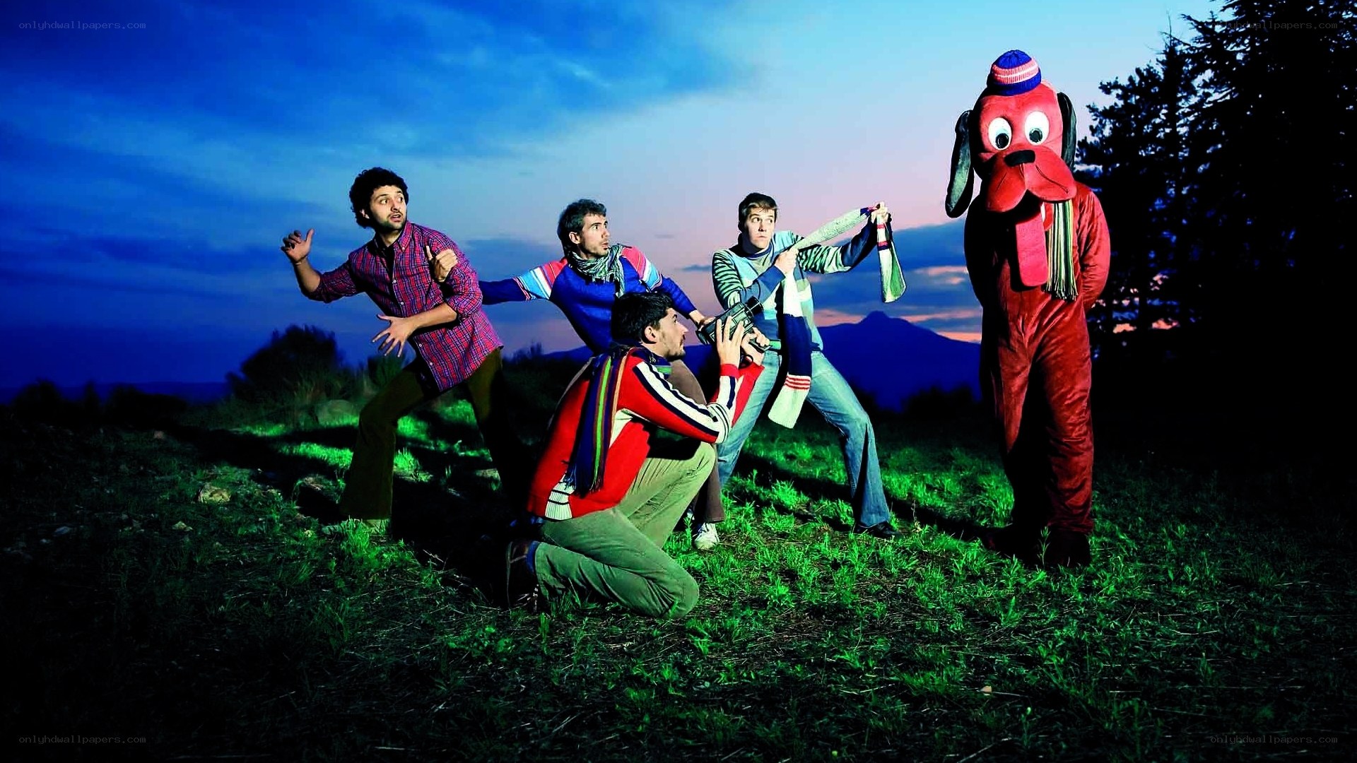 Men and mascot in dramatic pose