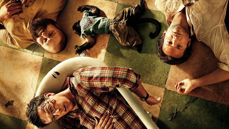 Men and monkey on floor