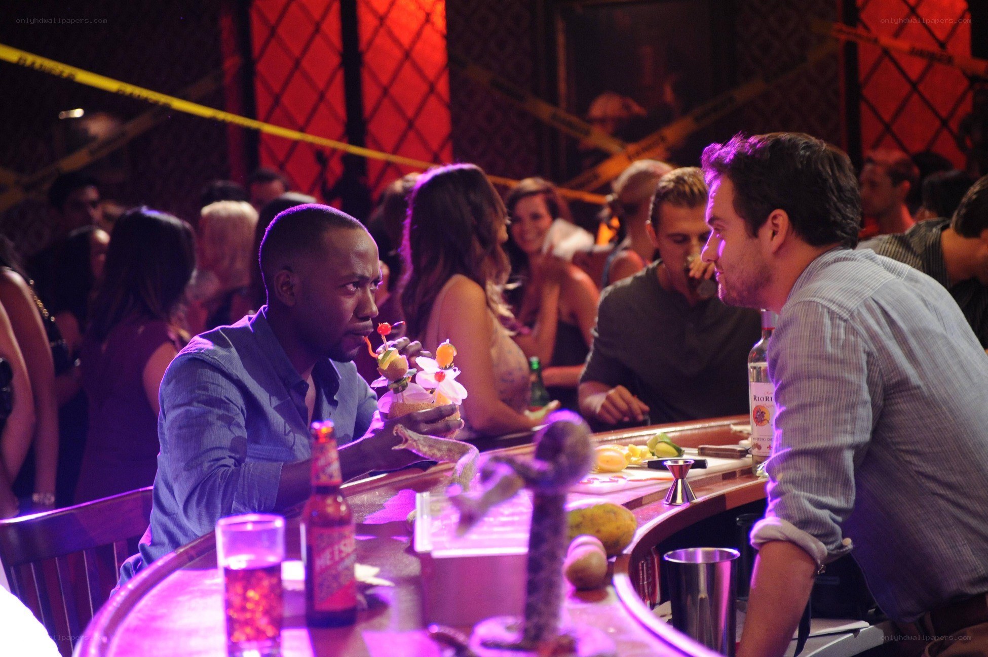 Men at a bar with caution tape