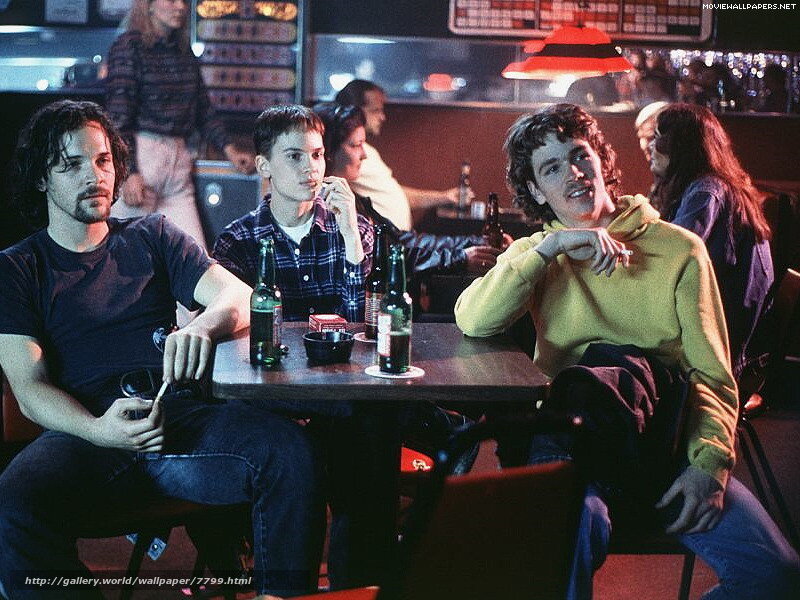 Men at a bar with drinks
