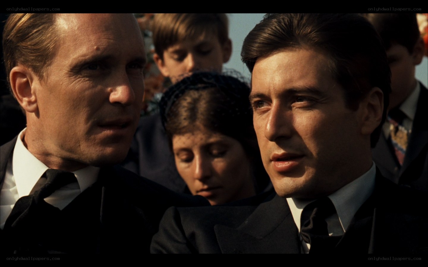 men at a funeral scene