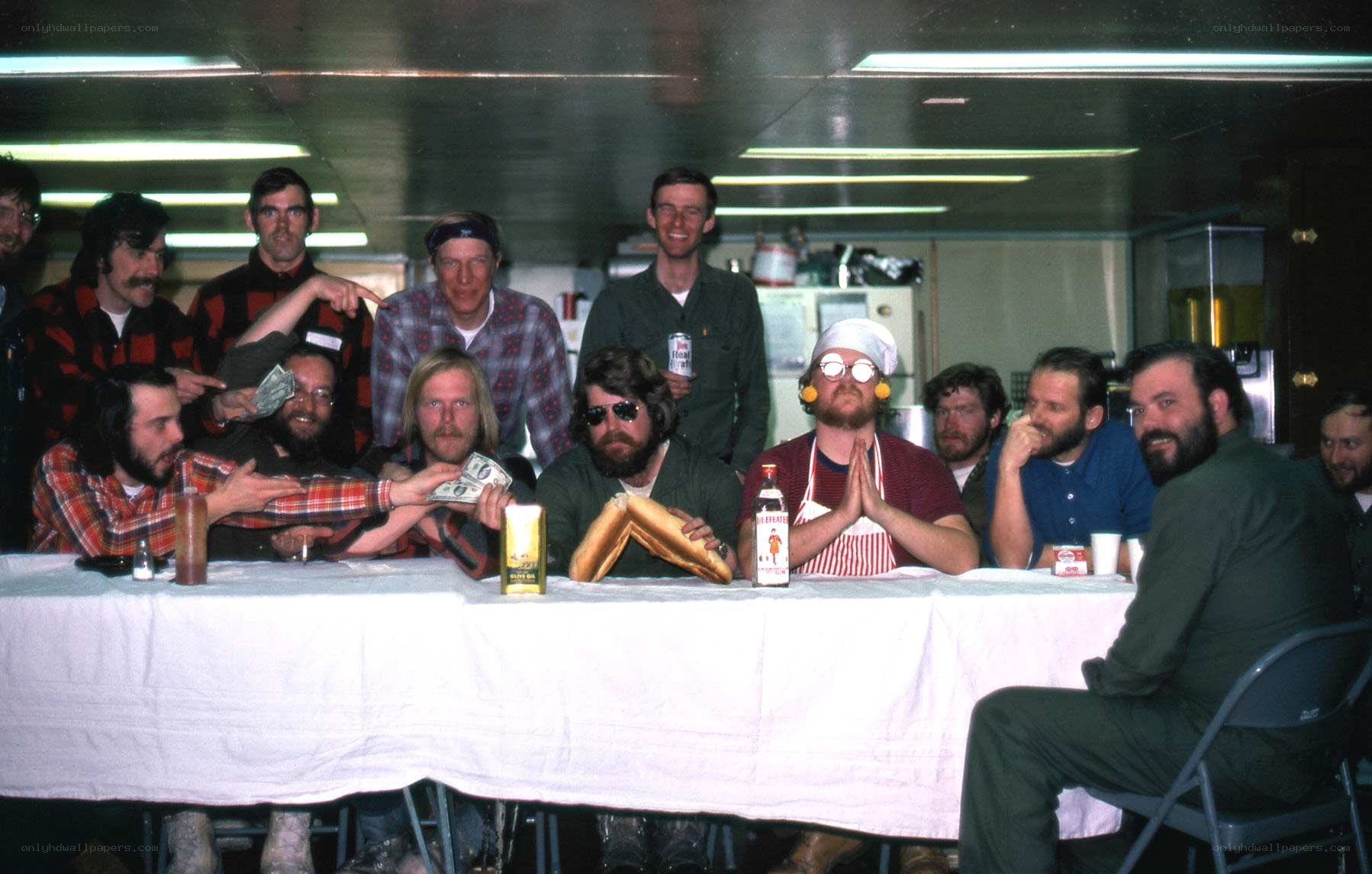 Men at a long table with food