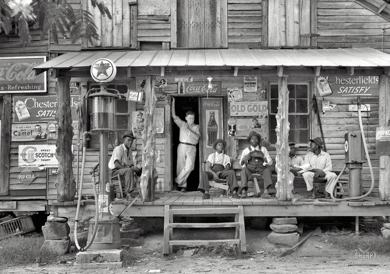 Men at a vintage gas station