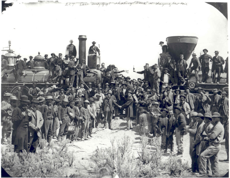 Men at railroad completion ceremony