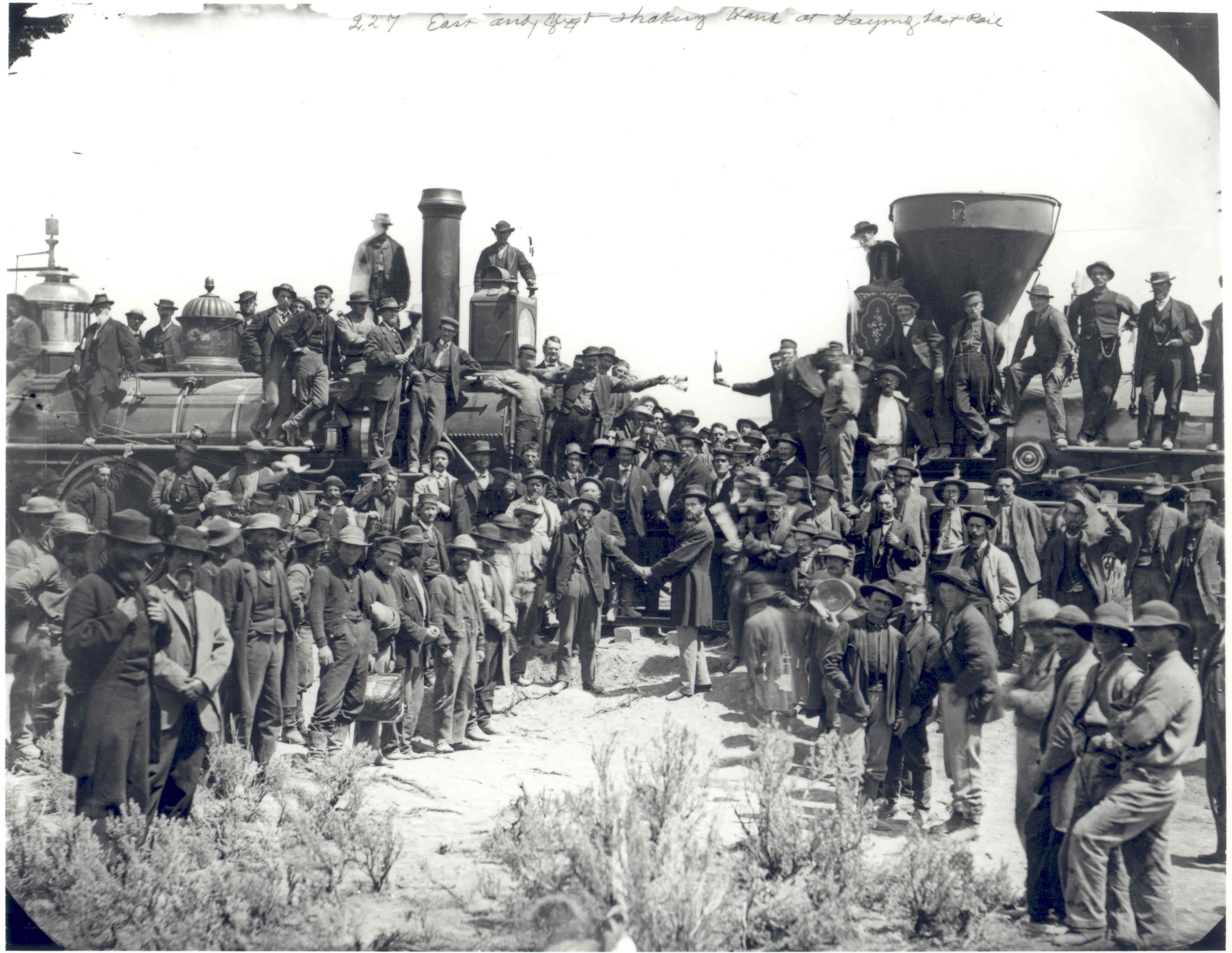 Men at railroad completion ceremony