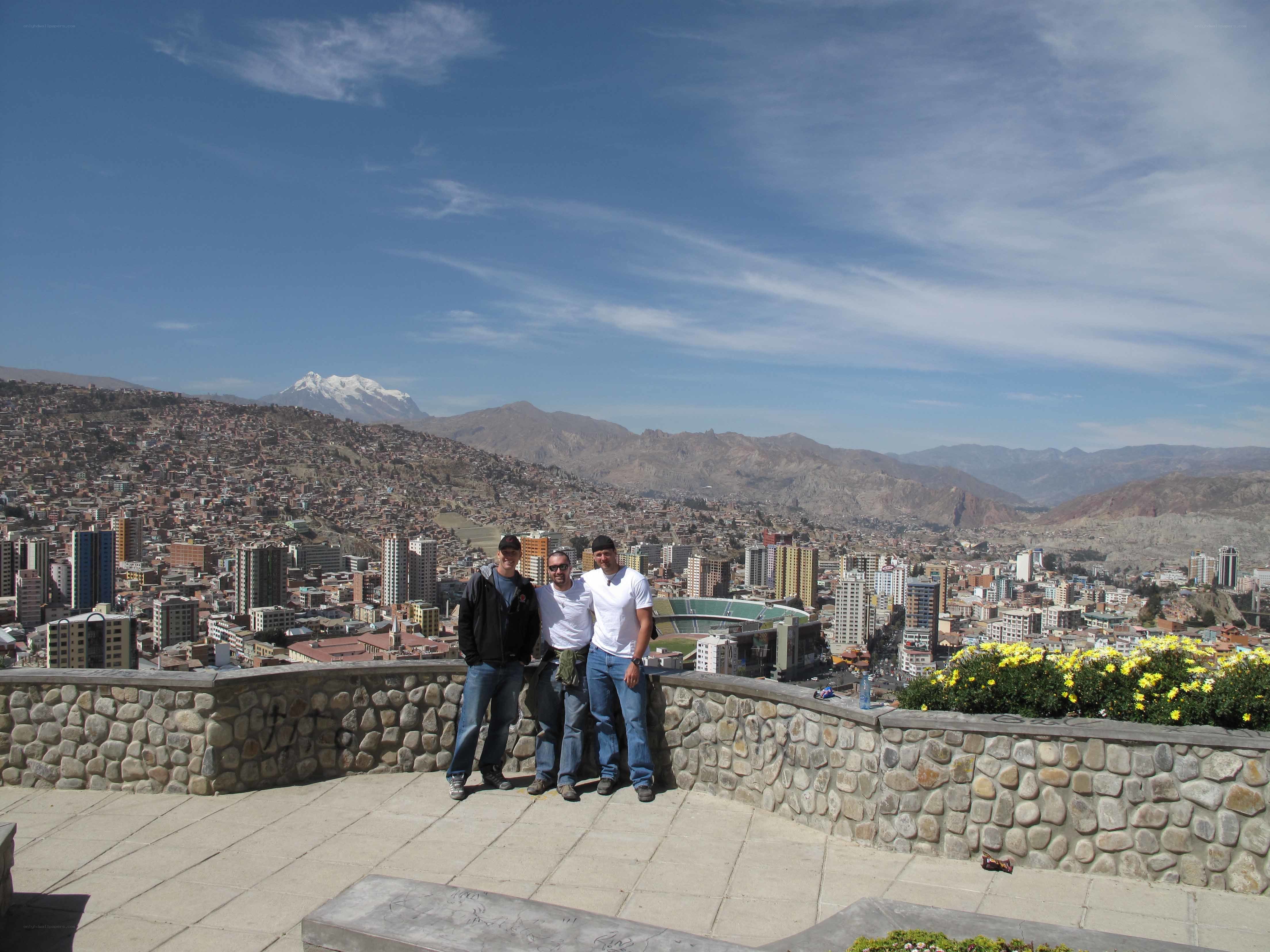 Men at viewpoint with city view