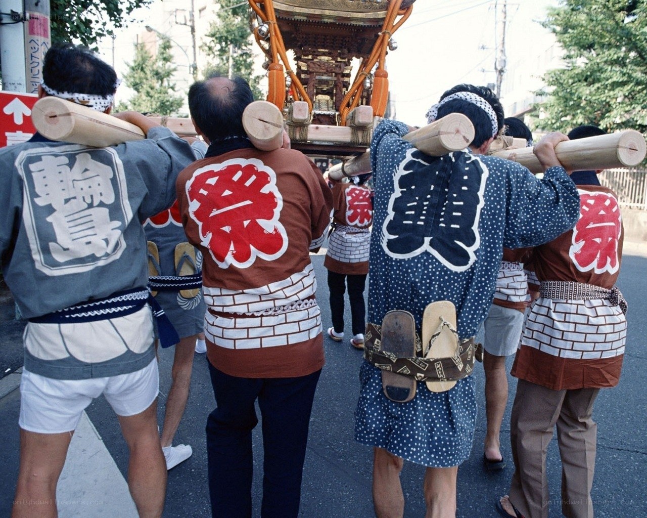 Men carrying a festival float