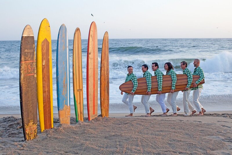 Men Carrying Surfboard