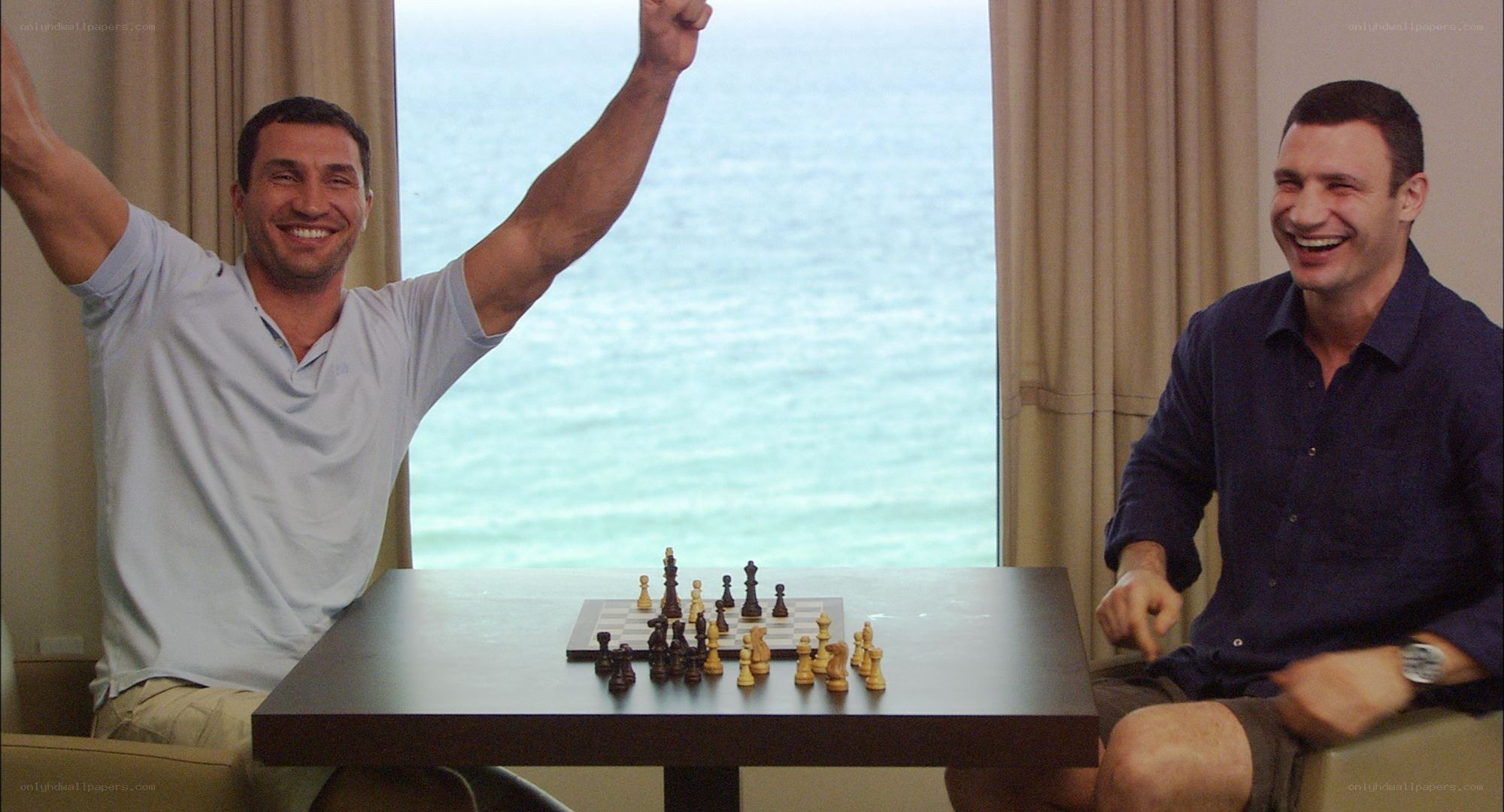 Men celebrating chess victory