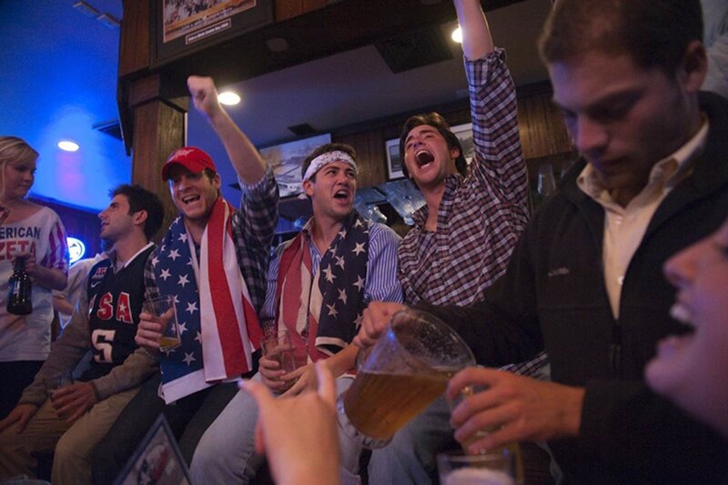 Men Cheering at Bar