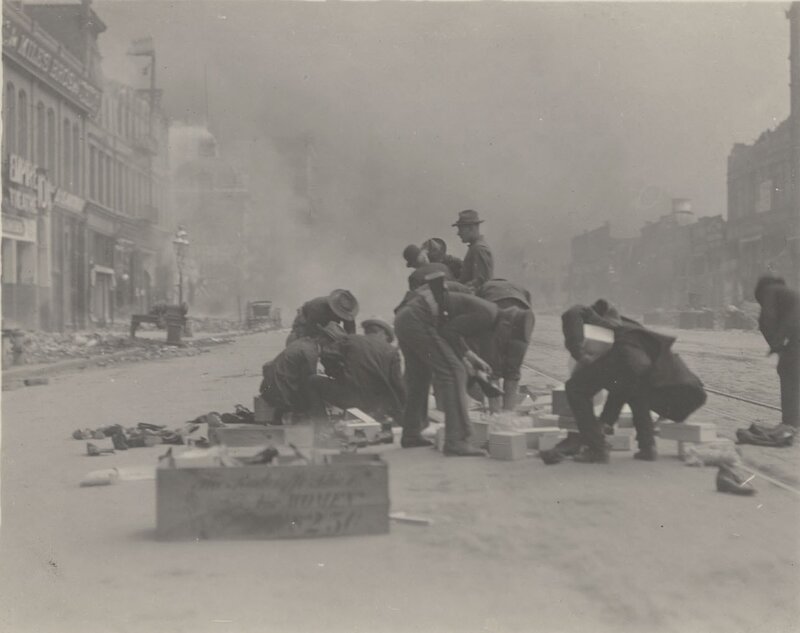Men clearing debris after explosion