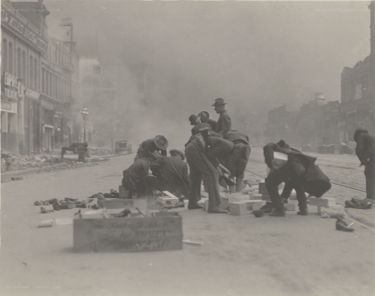 Men clearing debris after explosion