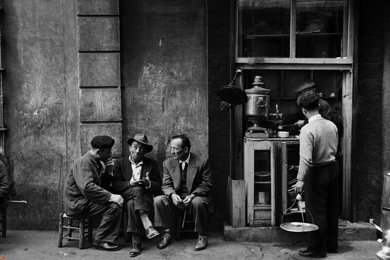 Men conversing on a street