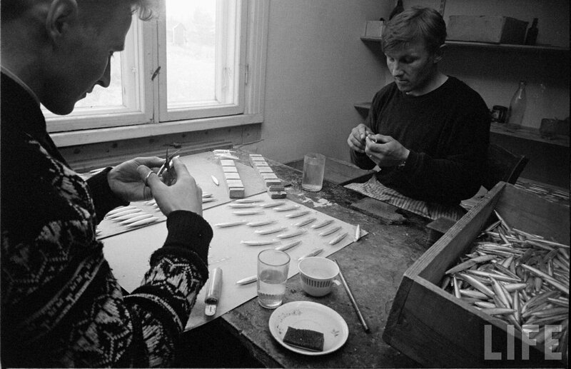 Men crafting fishing lures
